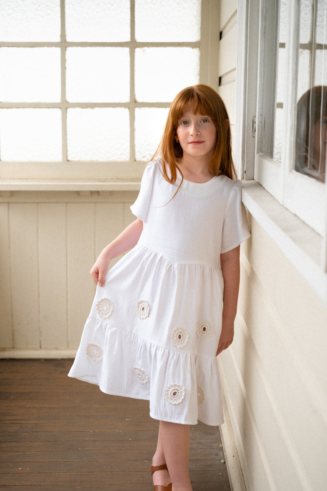 White linen dress with crocheted flowers