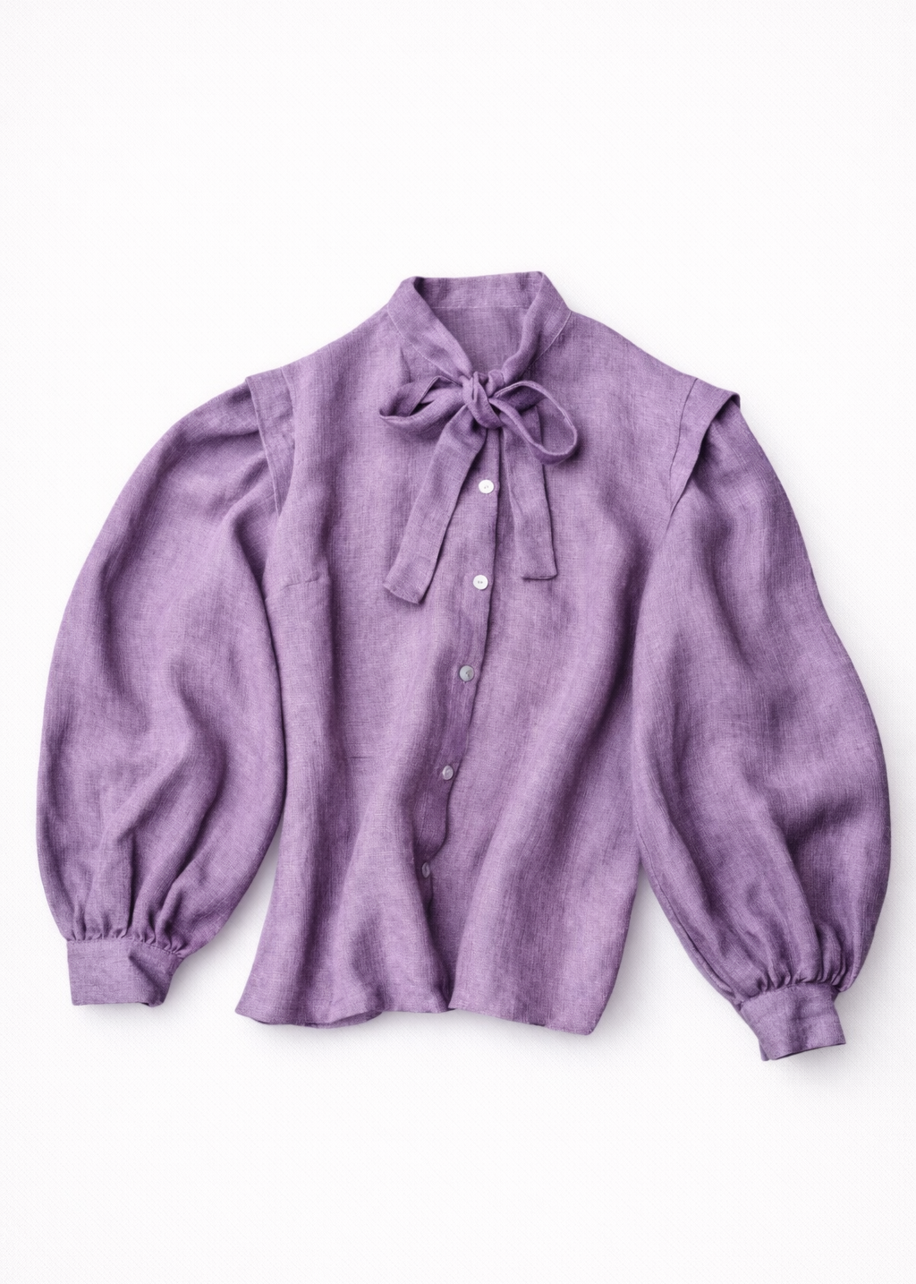 Purple blouse with balloon sleeves and a bow tie on a white background