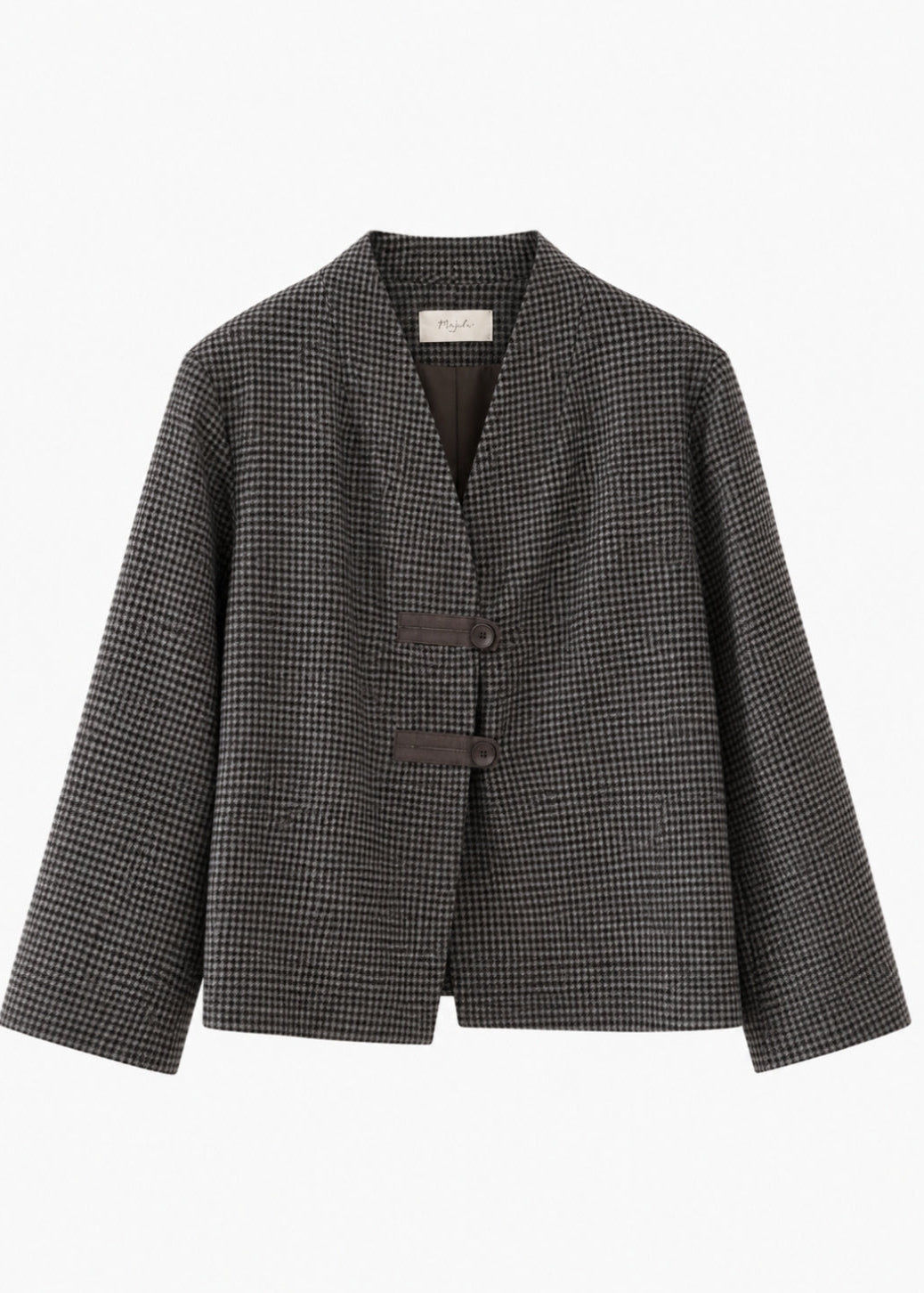 A women's long-sleeve blazer jacket featuring a fine black and white micro-check pattern, a V-neckline, and two dark brown buttons on the front, displayed against a solid white background.